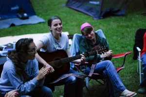 Singing around the campfire while camping!